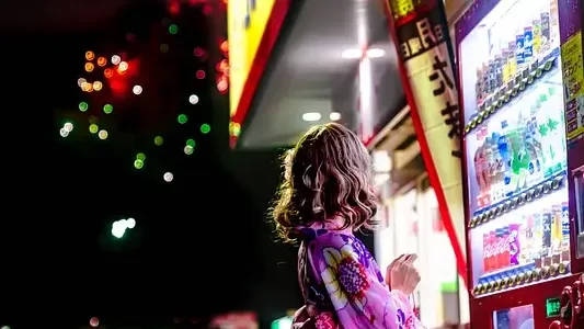 a girl next to a Vending machine